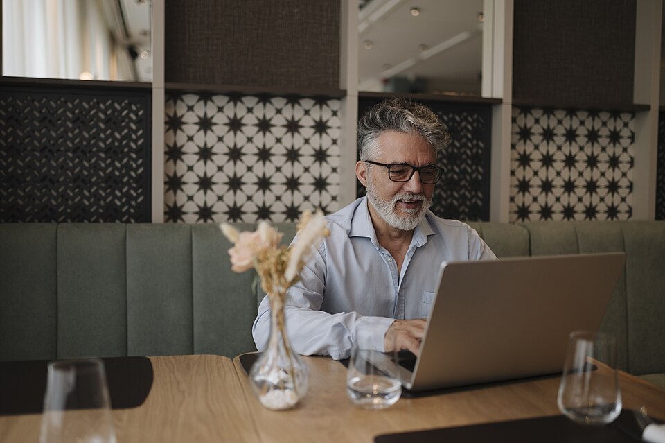 Restaurant owner working on a laptop